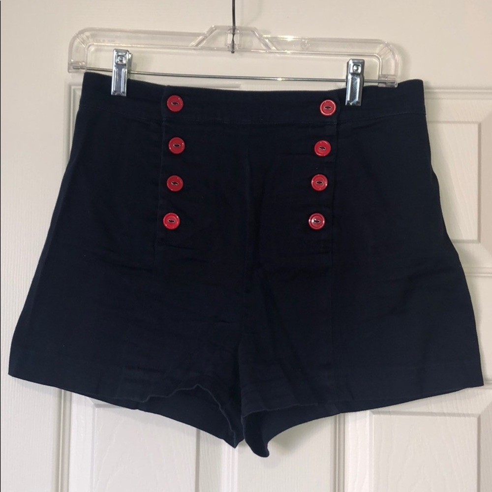 Navy shorts w/ red buttons